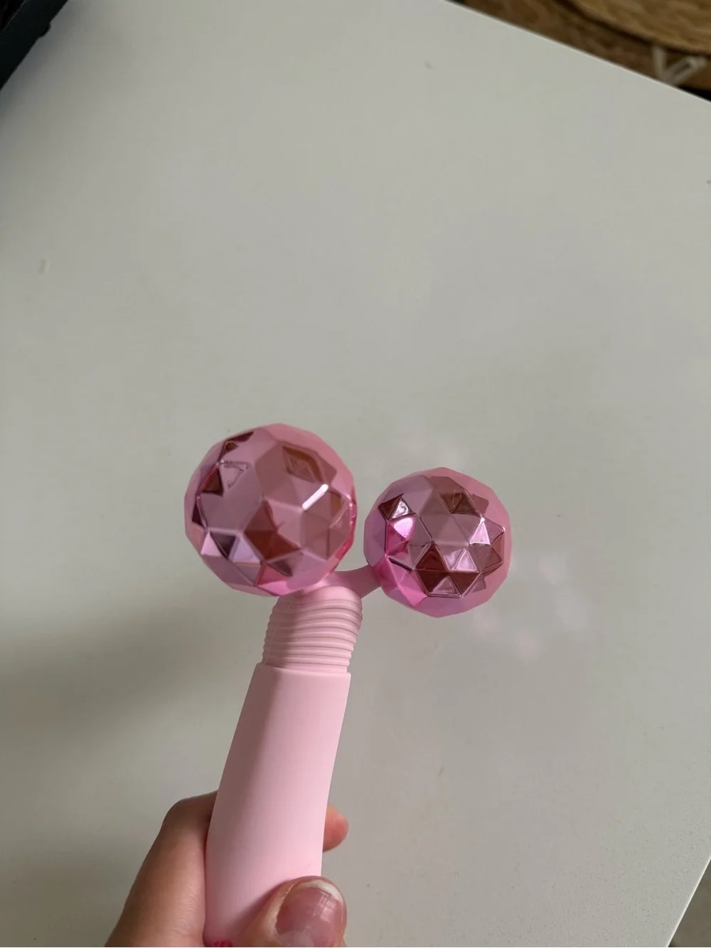 The Skinny Confidential pink balls facial massager